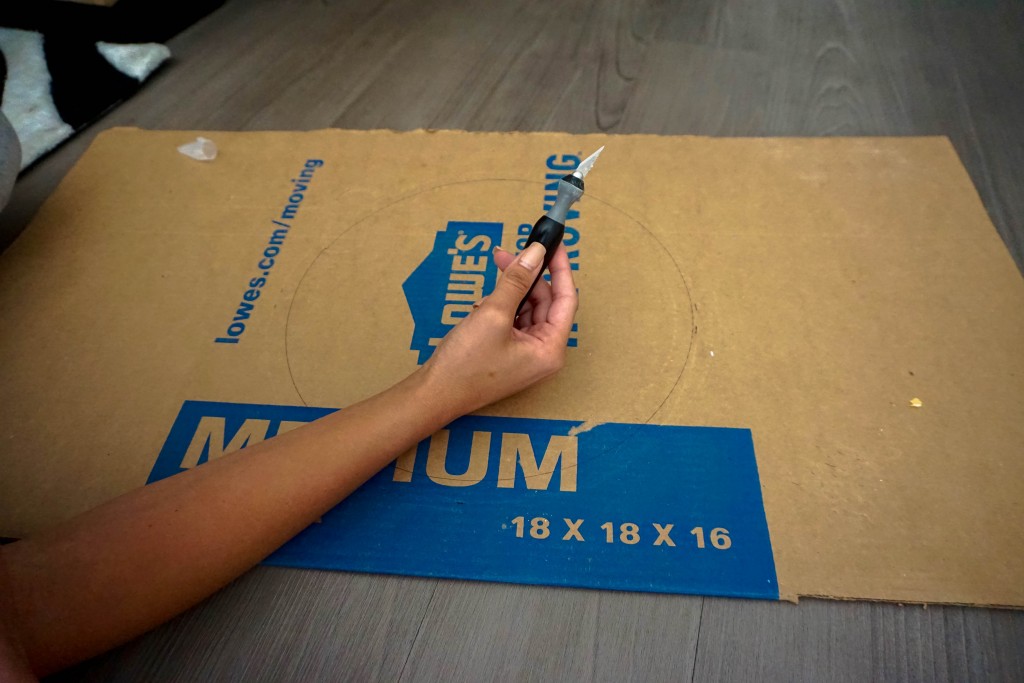 Use your X-acto knife to cut your circles from the cardboard. Try to make as clean cut as possible! 